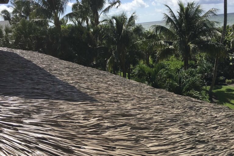 Synthetic palm thatch panels showing natural leaf texture